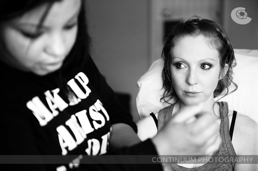 black and white image of a bride waiting for her makeup
