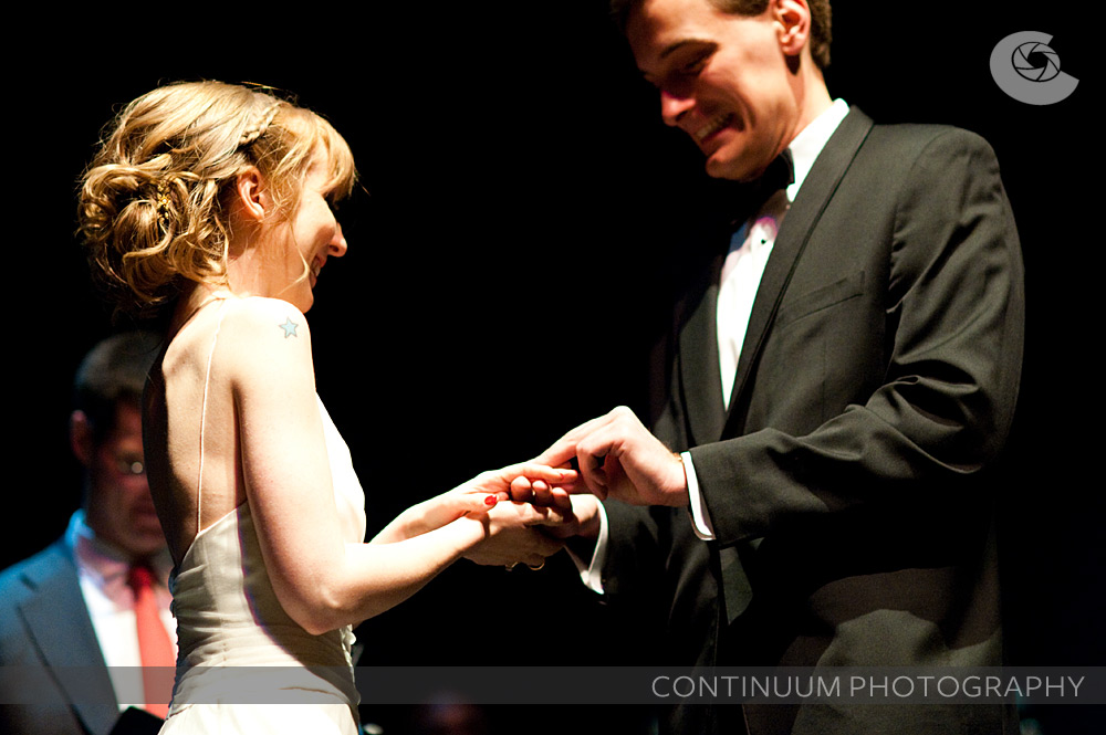 rings are exchanged at the vic theatre wedding in chicago