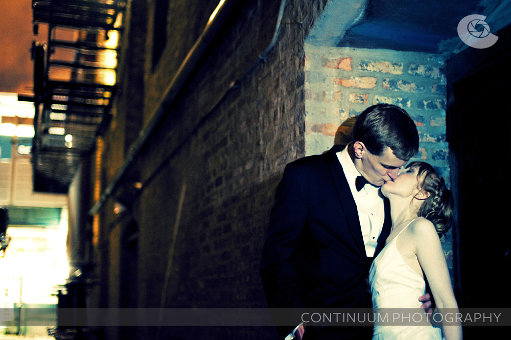 a romantic alley shot of the bride and groom at the vic theater in chicago