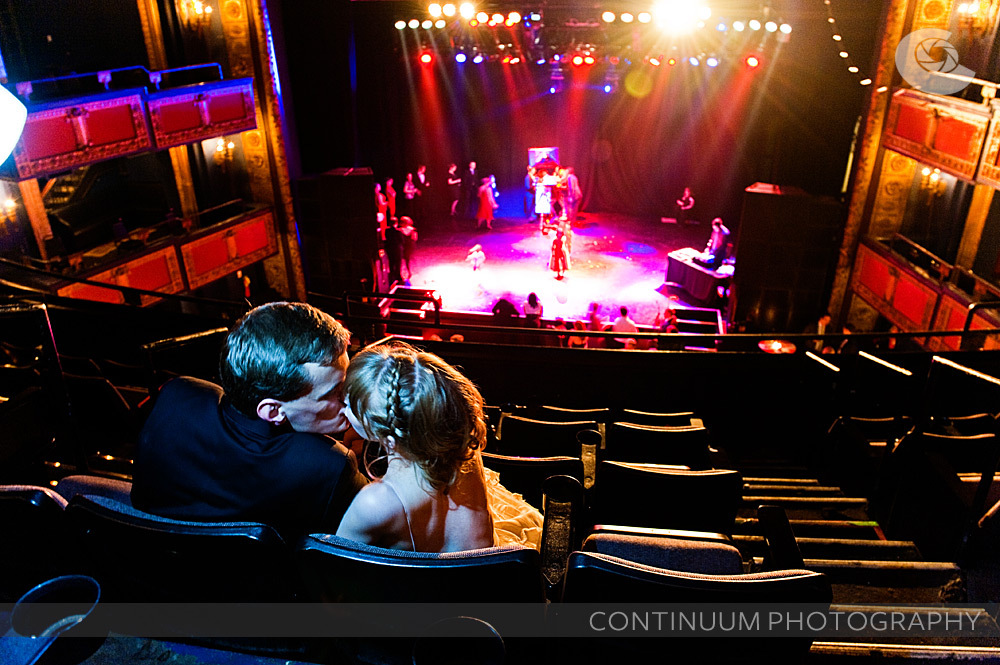 erin and frank kiss in the balcony of the vic theater in chicago