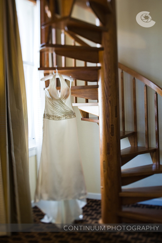 Bridal gown hanging in Hotel Vintage Plaza suite.