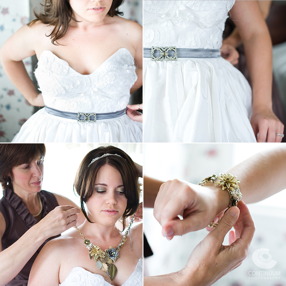 Bride putting on custom handmade DIY wedding dress with vintage wedding jewelry.