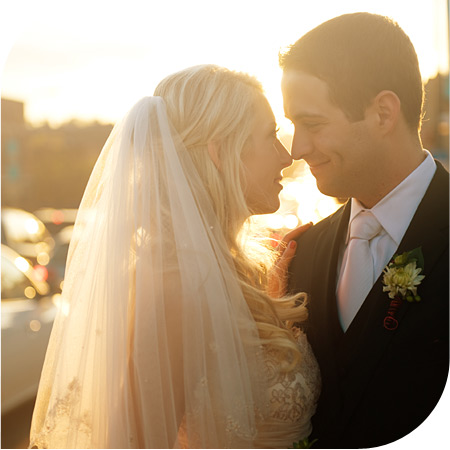 Happy bride and groom photo on Orange County beach on the way to their beautiful ocean front wedding reception.